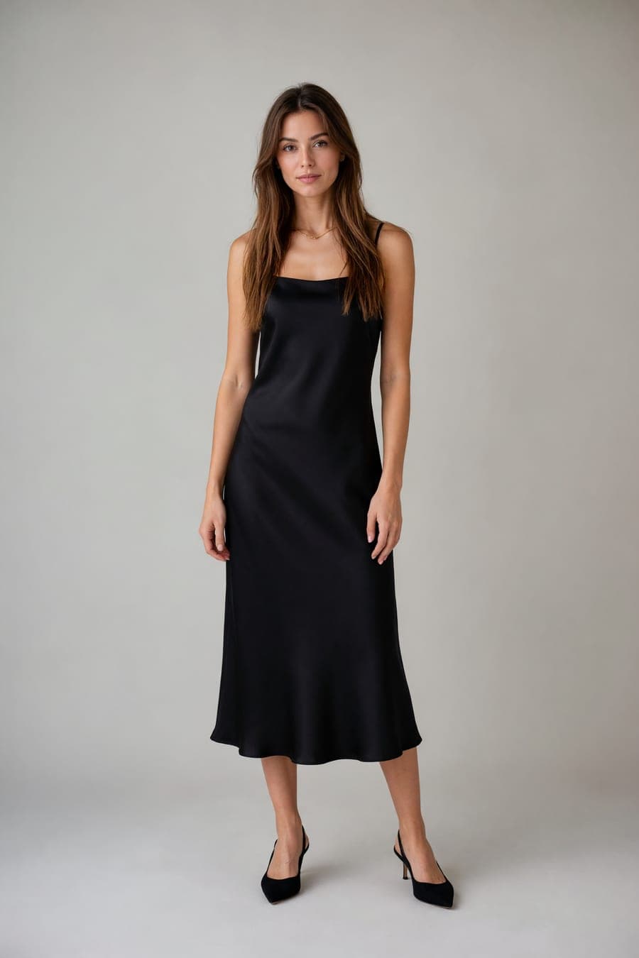 The same person wearing black slip midi dress, generated by AI