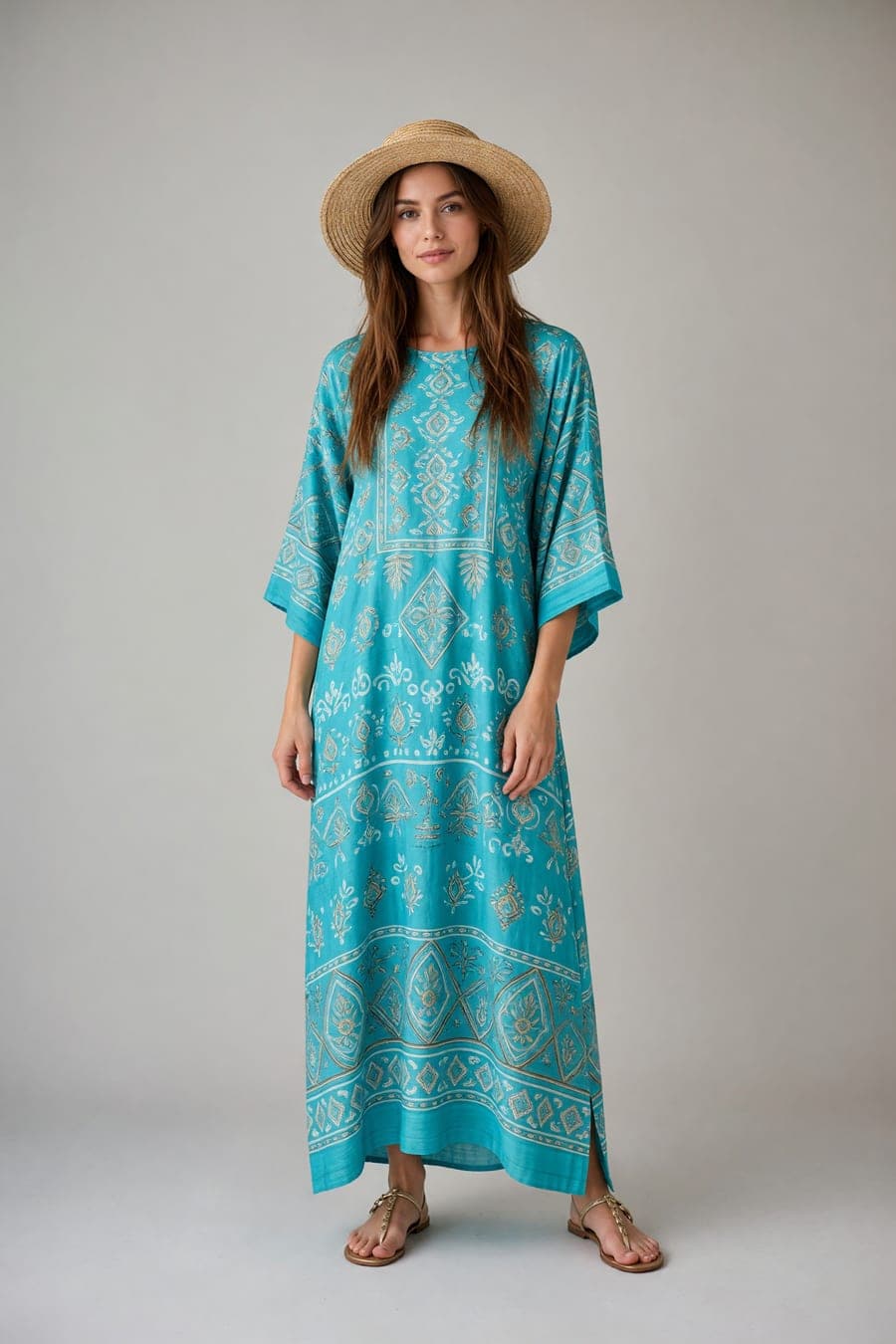 The same person wearing turquoise beach kaftan, generated by AI