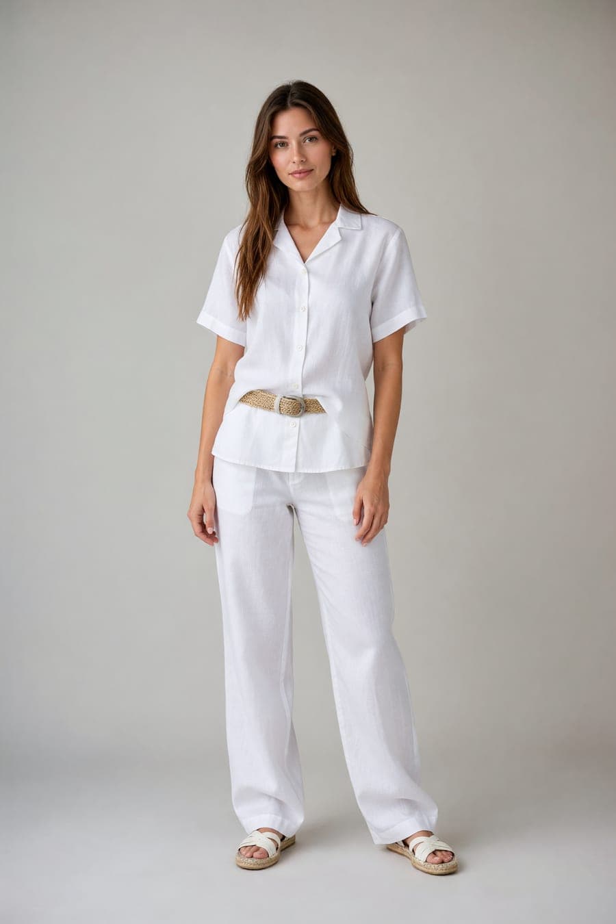 The same person wearing white linen shirt & trousers, generated by AI